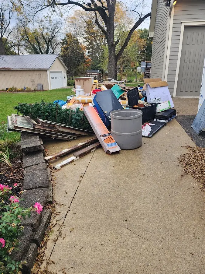 Dumpster being loaded with debris for Roofing Dumpster Rental in La Blanca